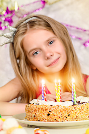 Beautiful little girl enjoys her birthday. Celebration, life events. Happy birthday.