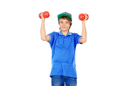 Portrait of a teenager boy with dumbbells. Active and healthy lifestyle. Isolated over white.の写真素材