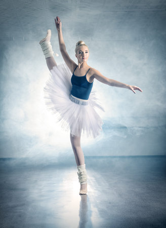 Art concept. Beautiful ballerina dancing in ballet class.