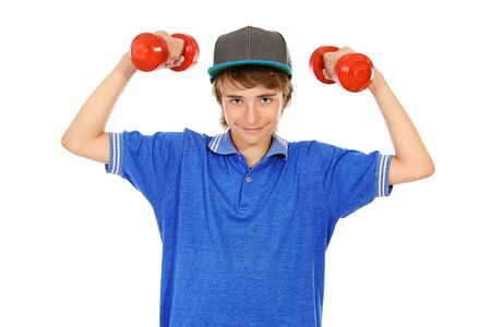 Portrait of a teenager boy with dumbbells. Active and healthy lifestyle. Isolated over white.の写真素材