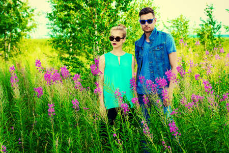 Fashionable models wearing jeans clothes posing outdoor. Denim style.の写真素材