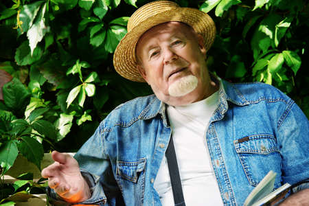 Portrait of a handsome senior man having a rest on a sunny summer day. Healthcare, resort. Happy retirement.の写真素材