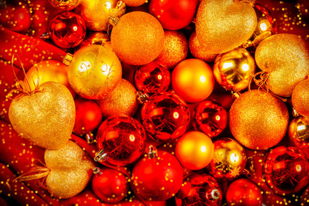 Close-up Christmas background with a lot of Christmas red and golden balls.