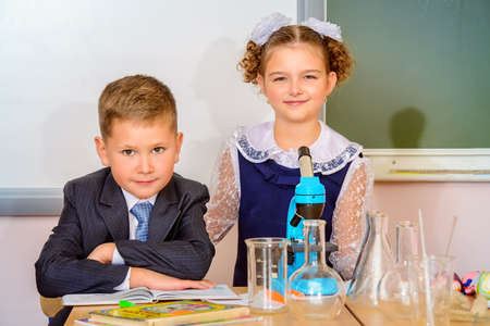 Students at the lesson of chemistry or biology in school. Educational concept.の写真素材