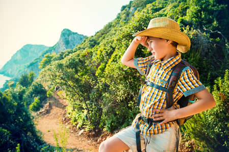 Happy boy on summer holidays. Outdoor activities, tourism and adventure.の写真素材