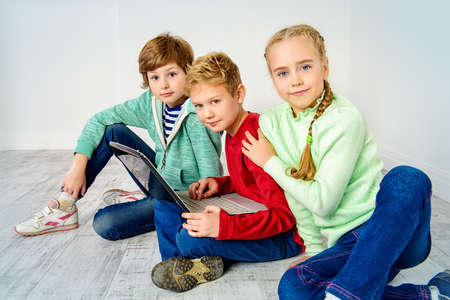 Three children friends spending time together.の写真素材