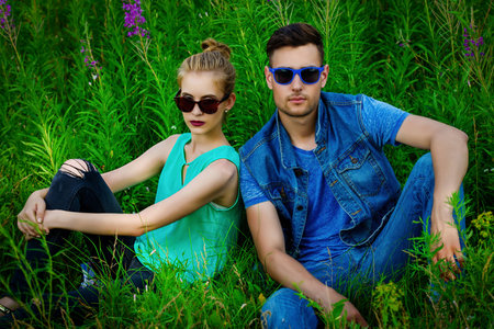 Fashionable models wearing jeans clothes posing outdoor. Denim style.の写真素材
