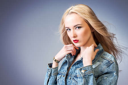 Portrait of a beautiful young woman with blonde hair.の写真素材