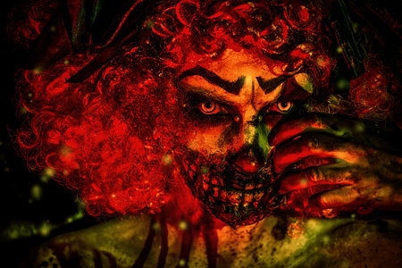Evil clown murderer stained in blood. Female zombie clown. Halloween. Horror.