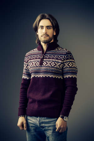 Handsome man wearing winter pullover. Men's beauty, fashion. Hairstyle for men. Studio shot.の写真素材