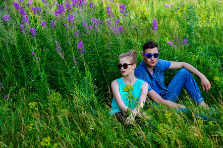 Fashionable models wearing jeans clothes posing outdoor. Denim style.の写真素材