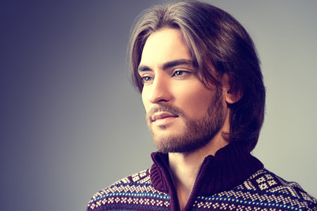 Handsome man wearing winter pullover. Men's beauty, fashion. Hairstyle for men. Studio shot.の写真素材