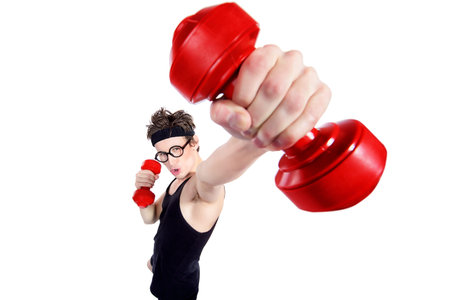 Funny thin man doing exercises with dumbbells. Bodybuilding, muscle building. Sports, activities concept. Isolated over white.の写真素材