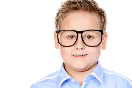 Portrait of a big confident smart boy wearing classic shirt and glasses. School uniform. Education. Copy space. Isolated over white background.の写真素材