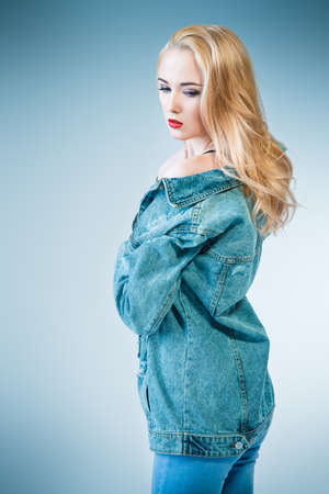 Portrait of a beautiful young woman with blonde hair. Cosmetics, make-up concept. Copy space.の写真素材