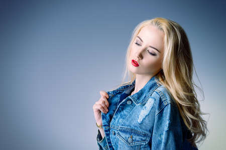 Portrait of a beautiful young woman with blonde hair. Cosmetics, make-up concept. Copy space.の写真素材