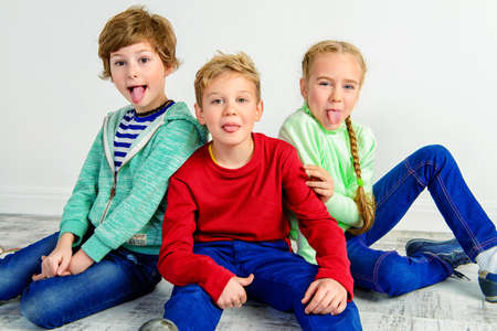 Happy joyful children having fun together. Children's fashion. Education. Happiness, activity and child concept.の写真素材