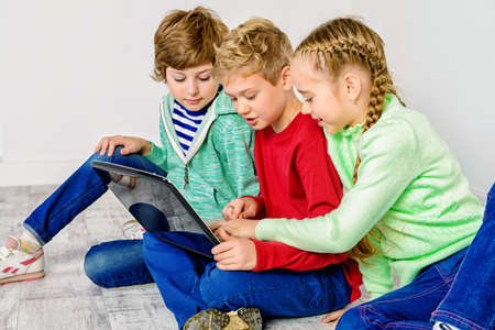 Three children friends spending time together. Friendship. Children's fashion.の写真素材