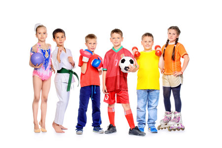 Sports and activities for children. Group of joyful boys and a girls engaged in various sports posing together. Education. Isolated over white background.の写真素材