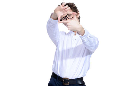 Funny handsome smart young man in big glasses. Emotions. Isolated over white.の写真素材