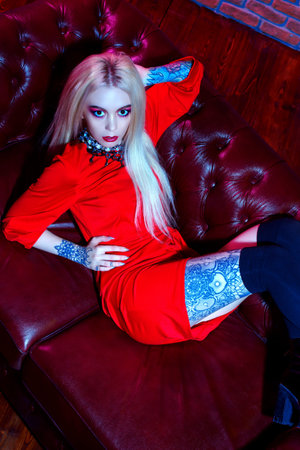 Extravagant glamorous woman with bright make-up and long blonde hair. Beauty, fashion concept....