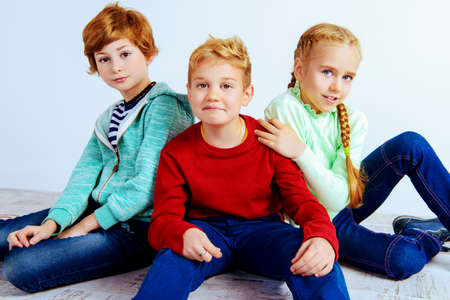 Happy joyful children having fun together. Children's fashion. Education. Happiness, activity and child concept.の写真素材