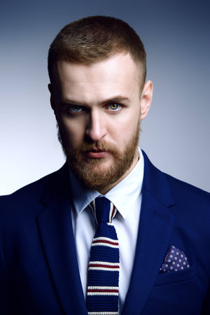 Portrait of a handsome man wearing elegant suit. Male beauty, fashion. Studio shot.の写真素材