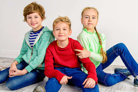 Happy joyful children having fun together. Children's fashion. Education. Happiness, activity and child concept.の写真素材