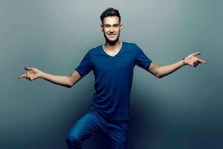 Portrait of a positive smiling young man. Studio shot.の写真素材