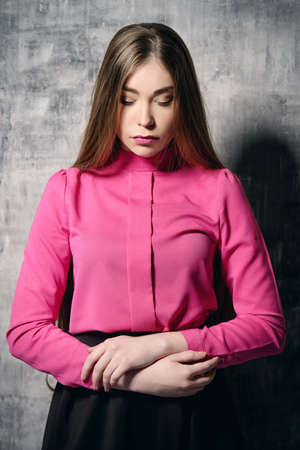 Portrait of a beautiful young woman with long brown hair. Make-up, cosmetics. Hair, healthy hair. Beauty concept.の写真素材