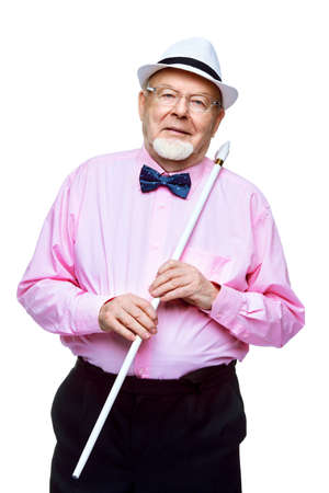 Handsome old man wearing elegant clothes and bow-tie. Isolated over white.の写真素材