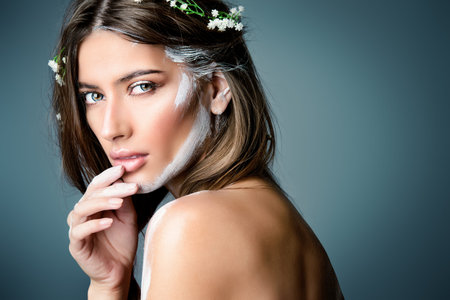 Fashion and make-up concept. Portrait of a beautiful girl with art make-up. Boho style. Body...