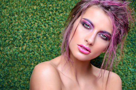 Make-up and cosmetics concept. Beauty portrait of a sexual woman with bright make-up. Hair, hair...
