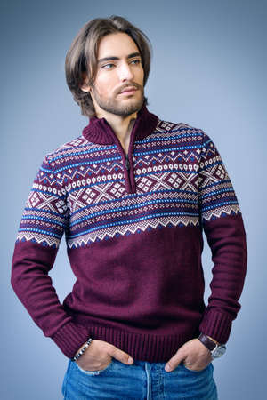 Handsome man wearing winter pullover. Men's beauty, fashion. Hairstyle for men. Studio shot.の写真素材