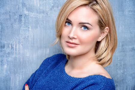 Close-up portrait of a beautiful well-groomed middle-aged woman. Skincare, rejuvenation, cosmetics.の写真素材