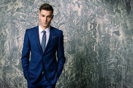 Fashion shot of a handsome young man in elegant classic suit. Men's beauty, fashion.の写真素材