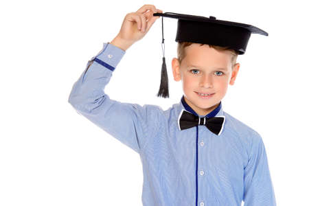Portrait of a cute smiling nine year old boy in elegant shirt and bow-tie. Kid's fashion. Education. Isolated over white background. Copy space.の写真素材
