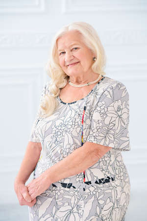 Beautiful senior woman spending time at home. Beauty, fashion. Happy retirement.の写真素材