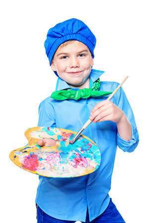 Different professions. Cute boy dressed in a costume of an artist holds brush and paints. Isolated over white.の写真素材