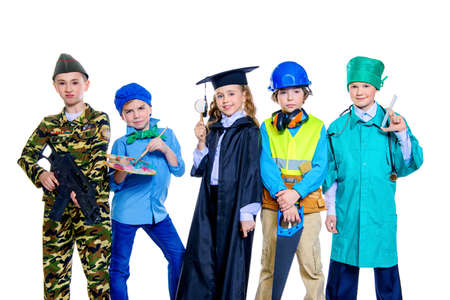 Different professions. A group of children dressed in costumes of different professions. Isolated over white.の写真素材