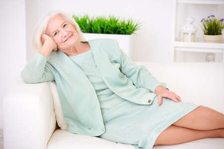 Beautiful senior woman spending time at home.の写真素材
