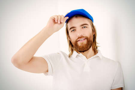Positive young man in casual clothes. White background.の写真素材
