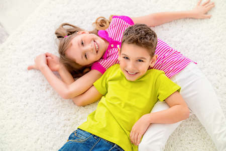 Portrait of happy joyful children at home. Family concept.の写真素材