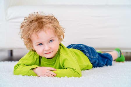 Happy 3 year old boy is playing at home. Child concept.の写真素材