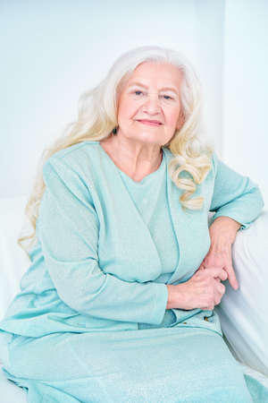 Beautiful senior woman spending time at home. Beauty, fashion. Happy retirement.の写真素材