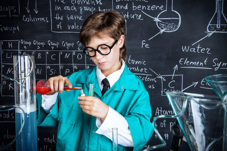 A?boy scientist making chemical experiments in the laboratory. Educational concept. Discovery.
