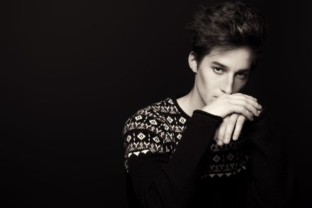 Man's hairstyle. Portrait of a handsome young man with stylish hair. Beauty, fashion.
