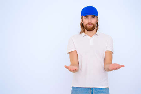 Positive young man in casual clothes. White background.の写真素材