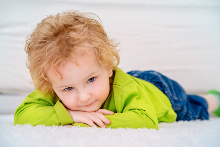 Happy 3 year old boy is playing at home. Child concept.の写真素材