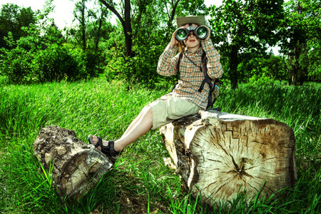Boy exploring nature and the world around us. Adventure trips. The young scout.